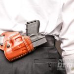 Hideaway Holsters: 8 Ways to Covertly Carry Your Weapon - Small Of The Back Carry