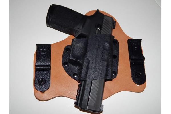 A CrossBreed SuperTuck holstering the Sig Sauer P320.