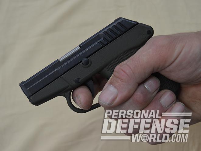 ortgies vest pocket and kel-tec p-32 pistol in hand