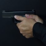 Pistol grip ways to hold a handgun thumbs forward
