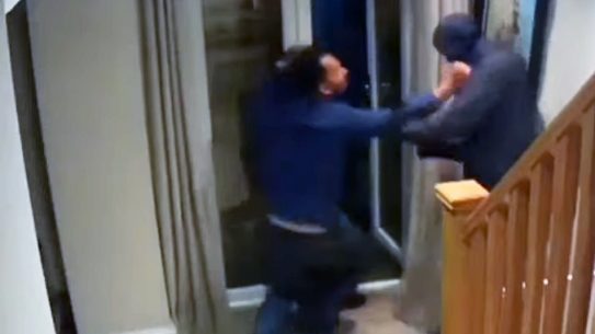 An English man fought off masked home intruders.