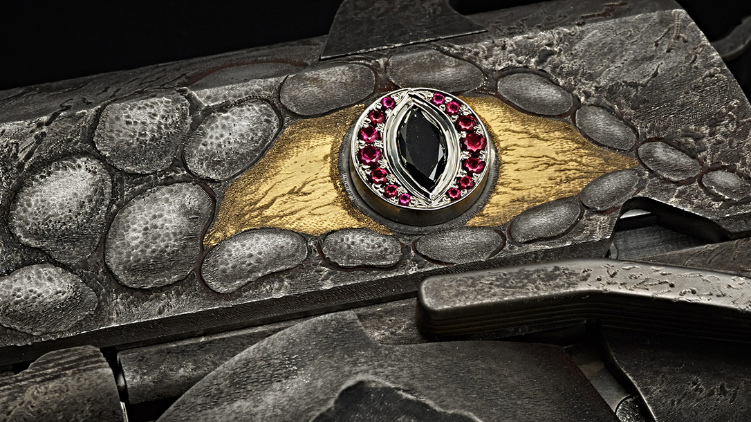 The pistol includes jewels for the dragon's eyes.