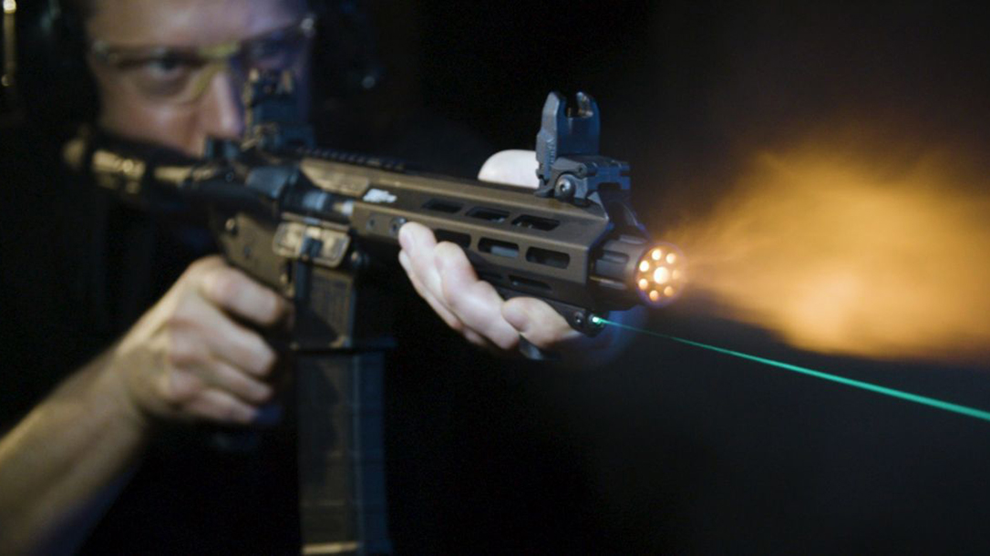 The Viridian HS1 combines a hand stop with a laser aiming device.