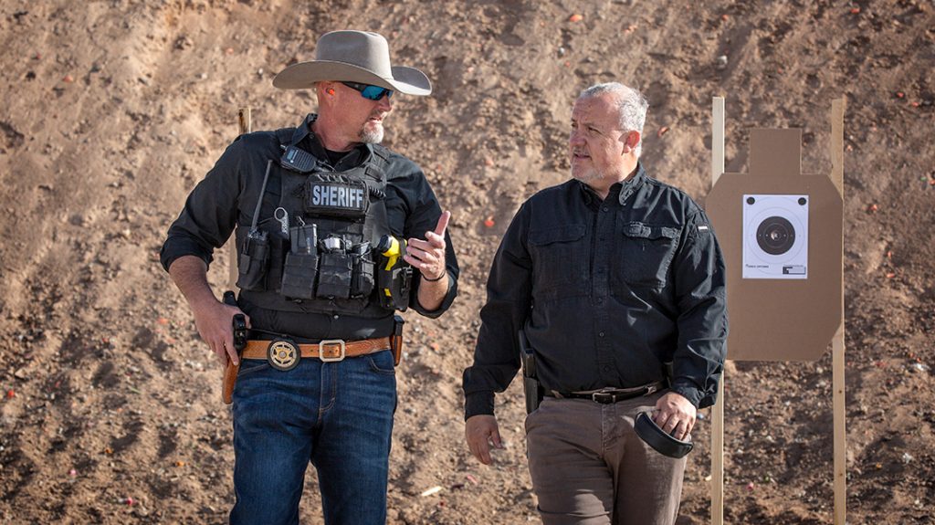 The author walks with Sheriff Mark Lamb on the range.