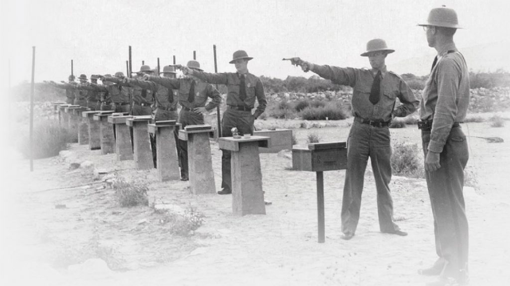 Old photo of law enforcement training with the .38, using a single hand stance.