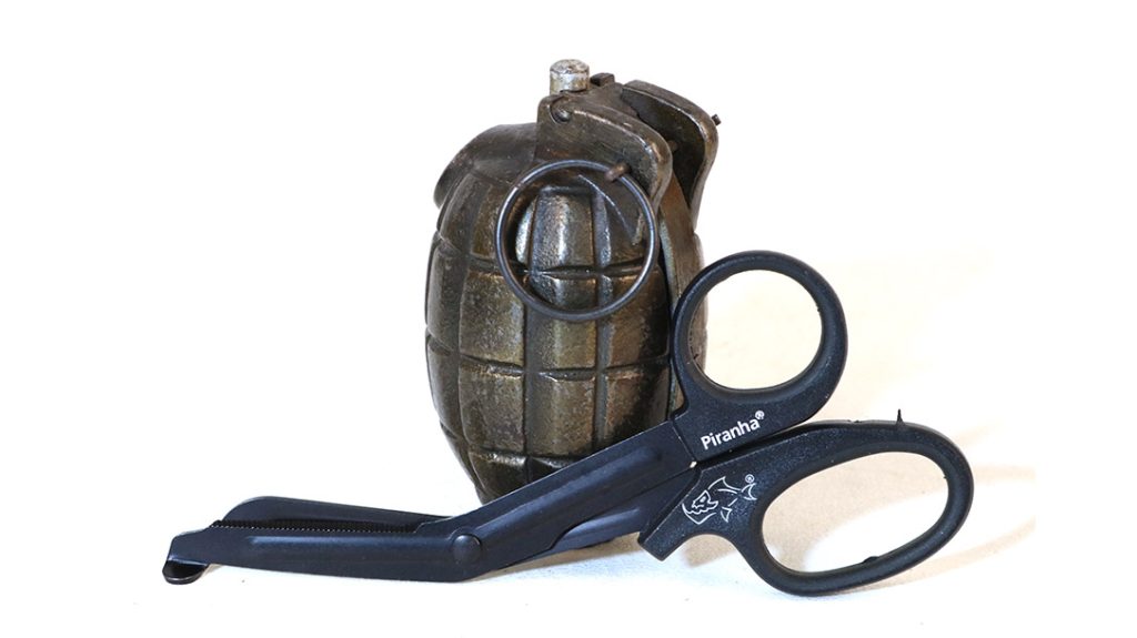 Piranha miniature trauma shears will clear clothing and gear away from a wound so it can be addressed appropriately.