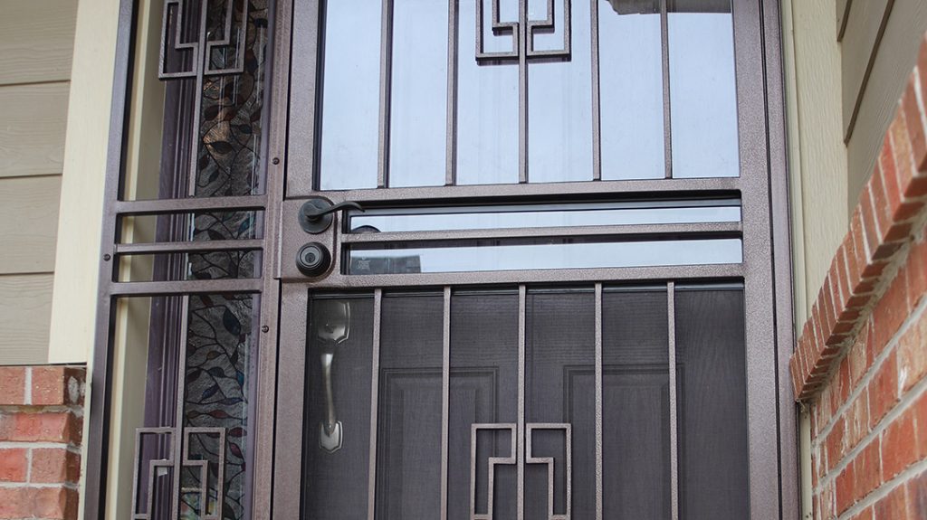 This security gate spans the door and adjacent window, providing a solid, lockable barrier and a strong deterrent.