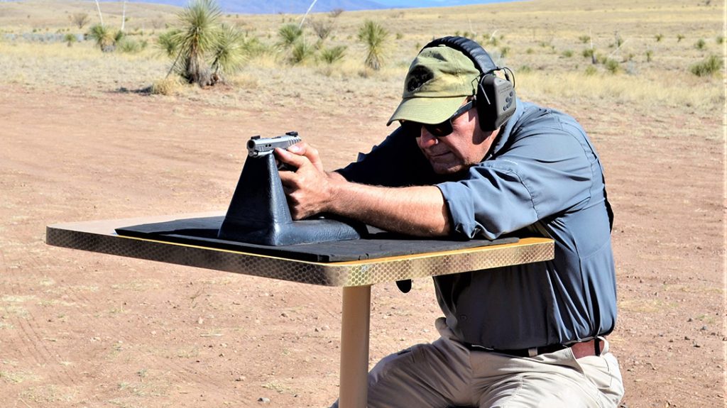 The author shoots the Kimber Micro 9 Rapide Black Ice from a benchrest.