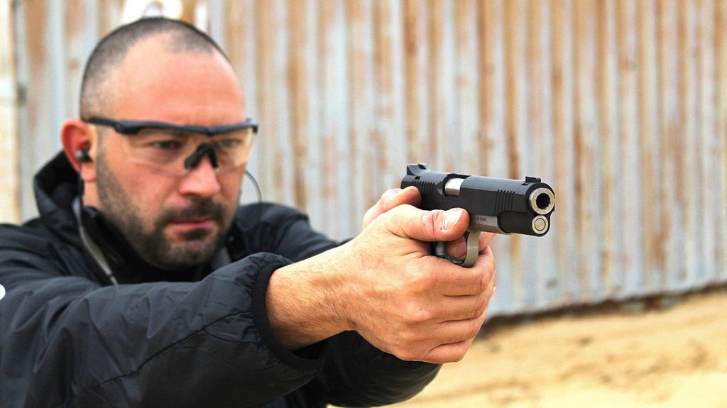 The author firing the Magnum Research G Model 1911.
